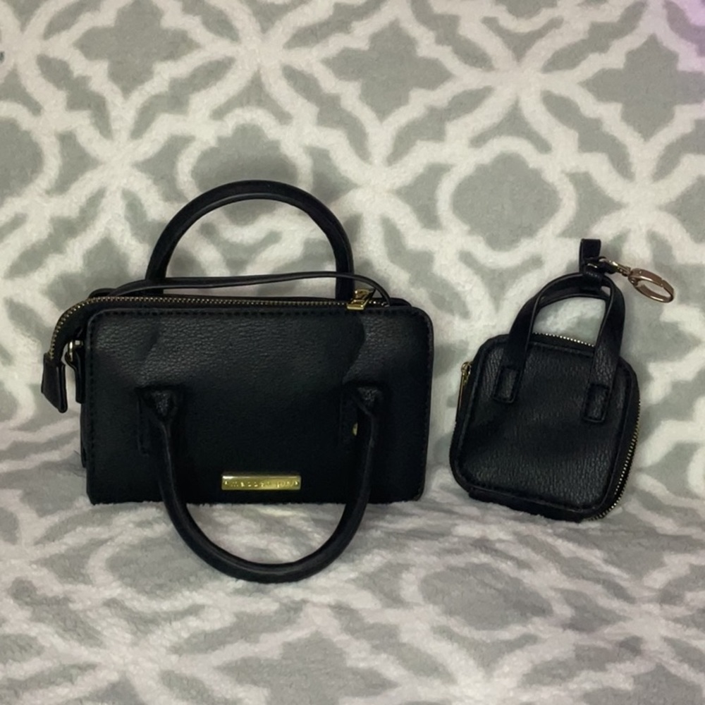 Cute small black and purse with shoulder strap and matching coin purse.